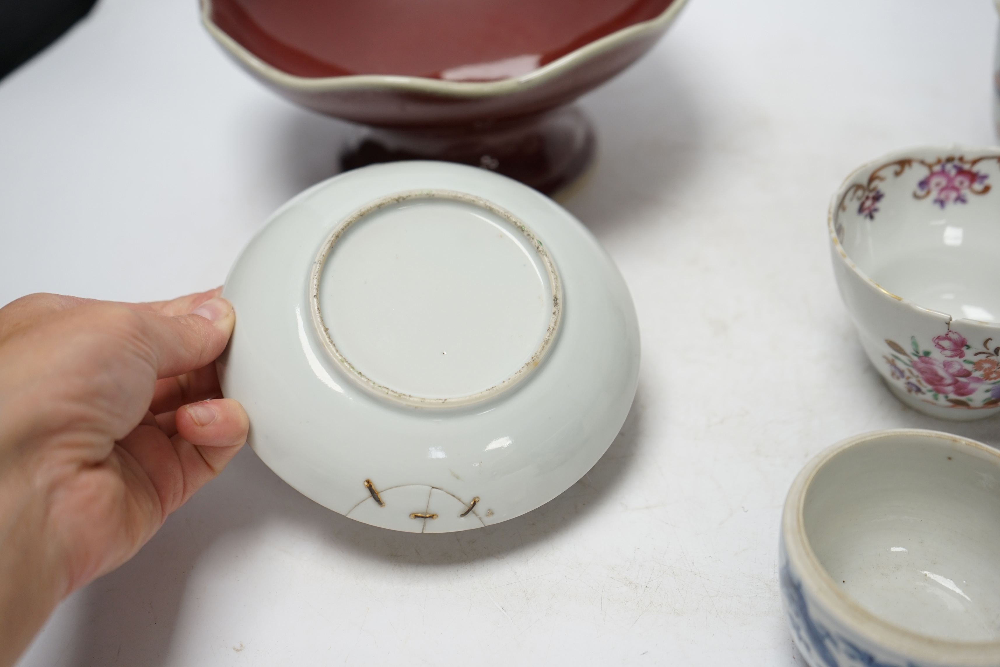 Chinese ceramics to include a sang de boeuf pedestal bowl and a famille rose dish, 20cm diameter. Condition - pedestal dish and one other good, others poor
